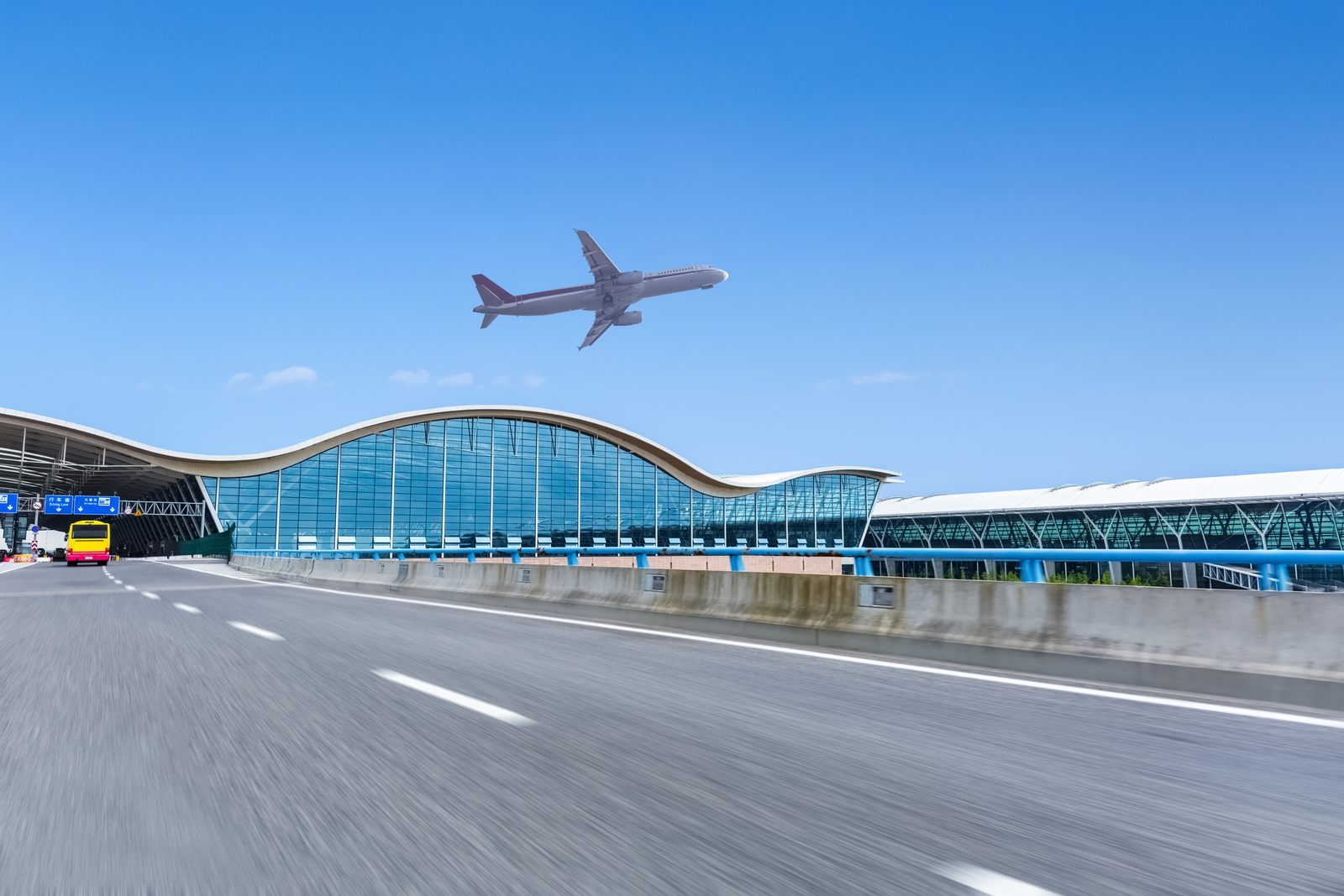 Airplane departing over the airport terminal